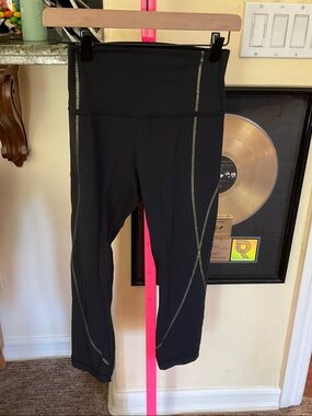 LULULEMON limited edition Black Crop Leggings with gold Metallic Stitch Detail